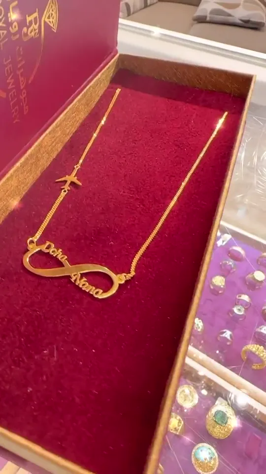 An infinity with two names and an aeroplane charm, boxed